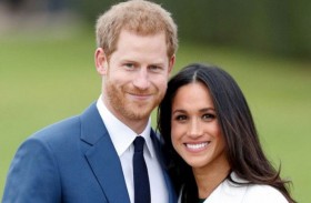 هاري وماركل يساهمان في بناء ملعب 