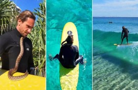 تغريم رجل 1500 دولار لركوبه الأمواج مع ثعبانه 