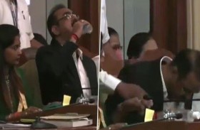 مسؤول يشرب مطهر اليدين