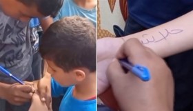 مشهد مؤلم.. أطفال غزة يكتبون أسماءهم على أجسادهم للتعرف على جثثهم إذا قتلوا